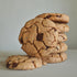 A stack of UniCookies chocolate chunk, The Regular Cookie, with a single cookie standing in front of a stack of cookies.